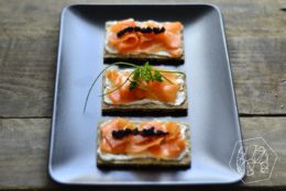 Carrot salmon, vegan cream cheese and caviar made from algae on swedish crispbread