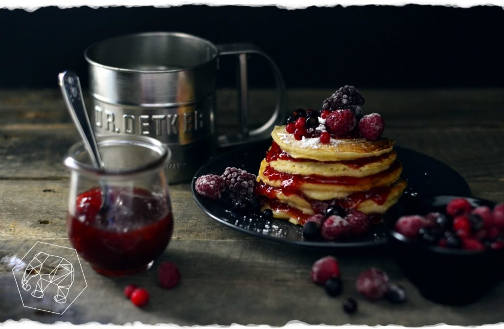 American pancakes with jam and forest berries 